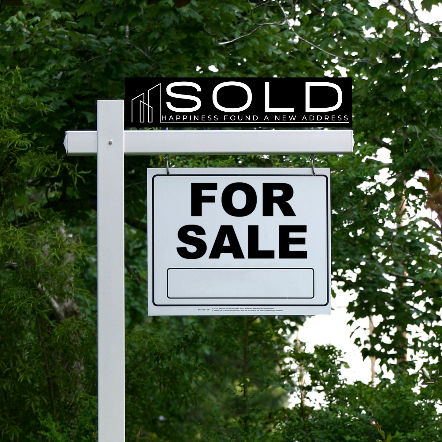 sold real estate sign with a black background that says happiness found a new address