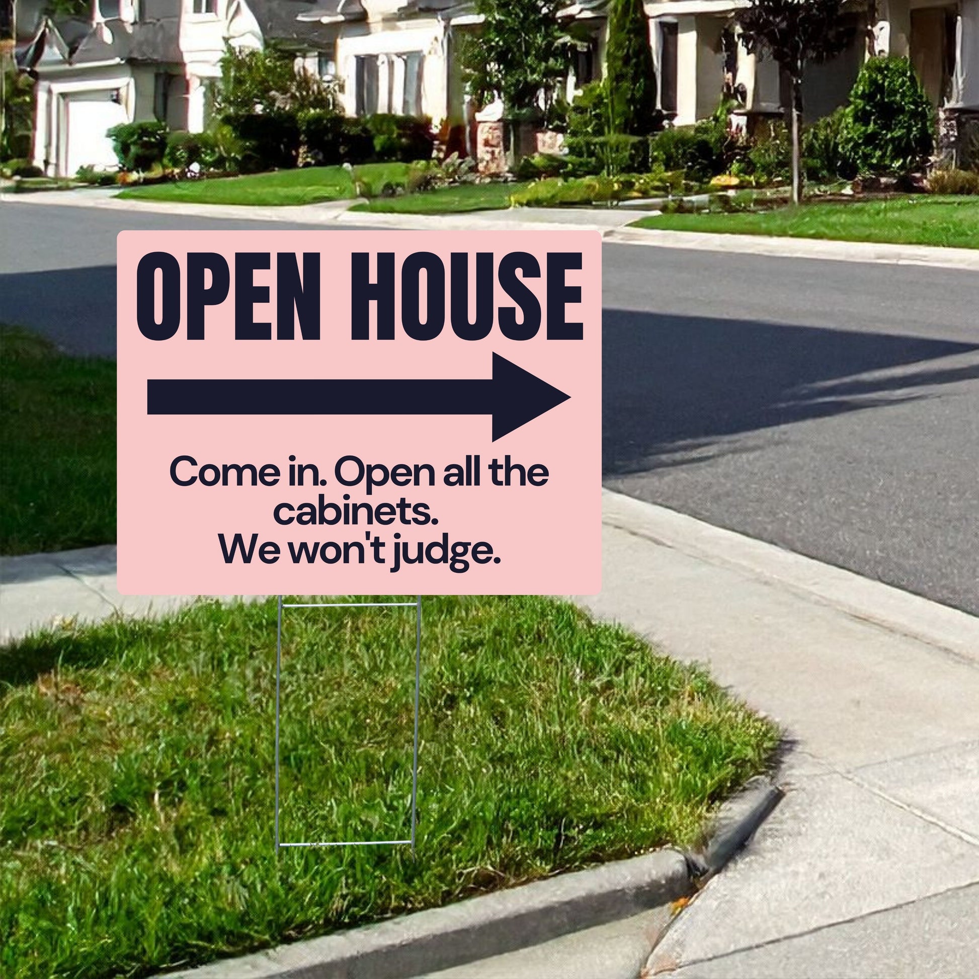 Open house sign with humorous text on a grassy lawn.