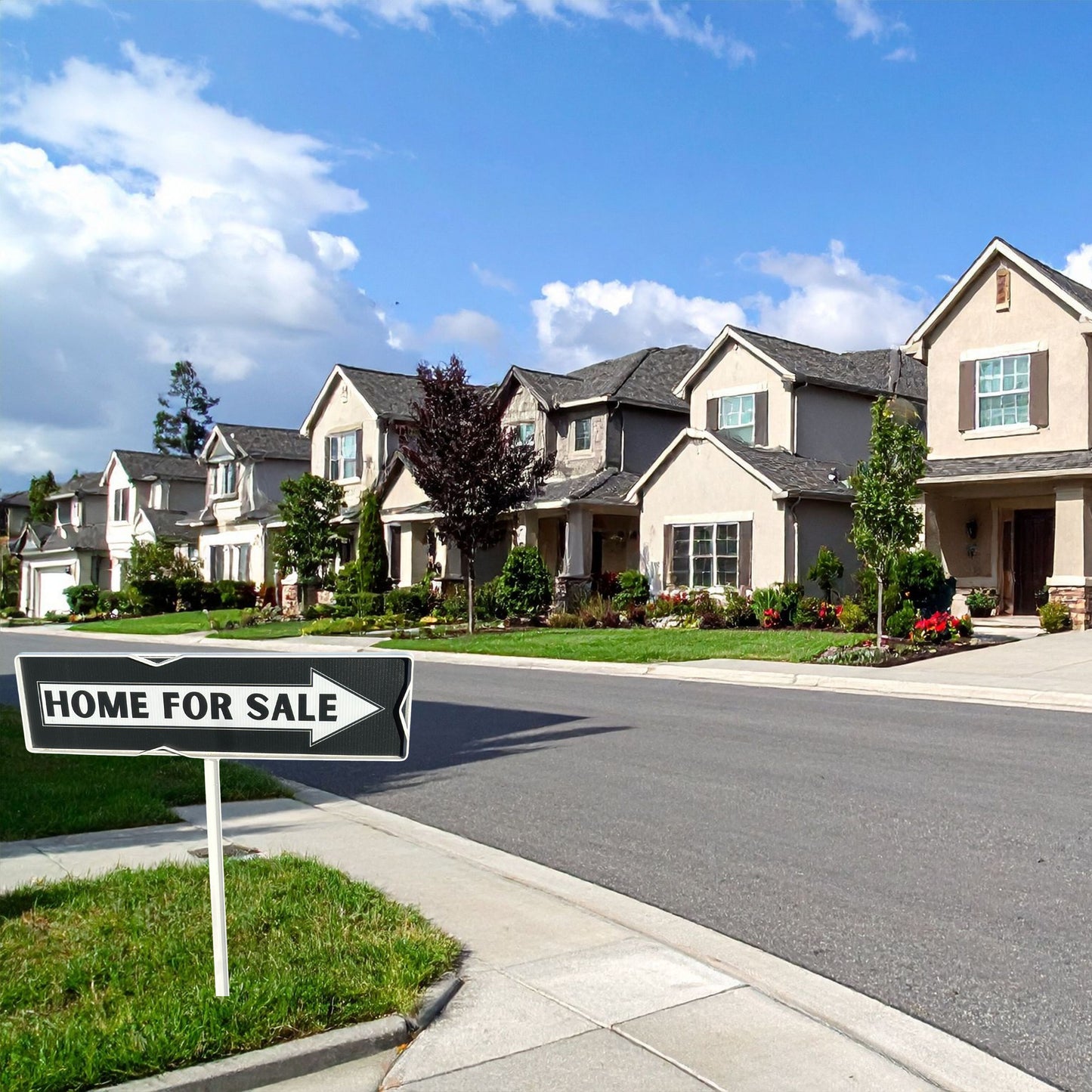 Neighborhood street with houses and a 'Home for Sale' directional sign.