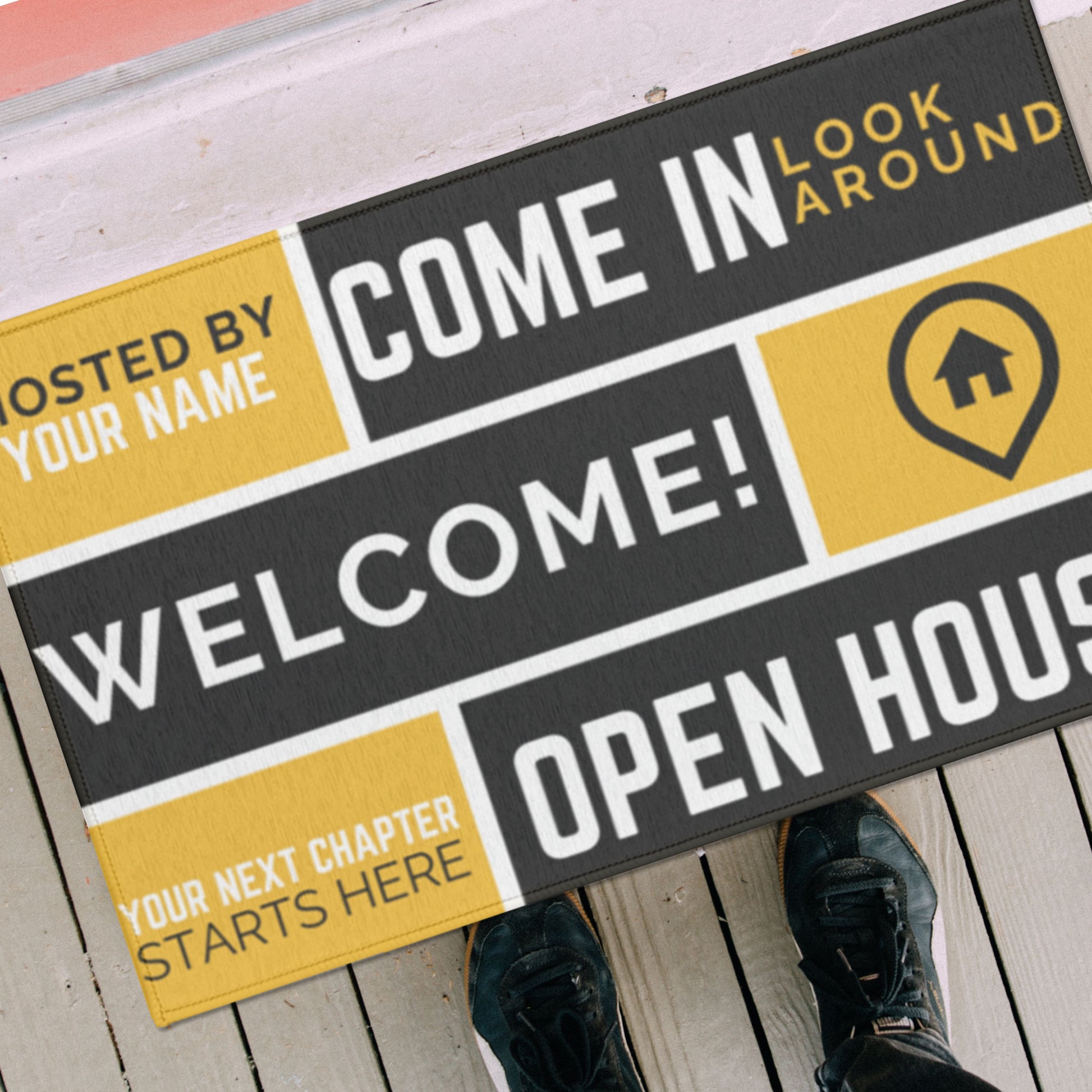 top view gold, black, white welcome mat