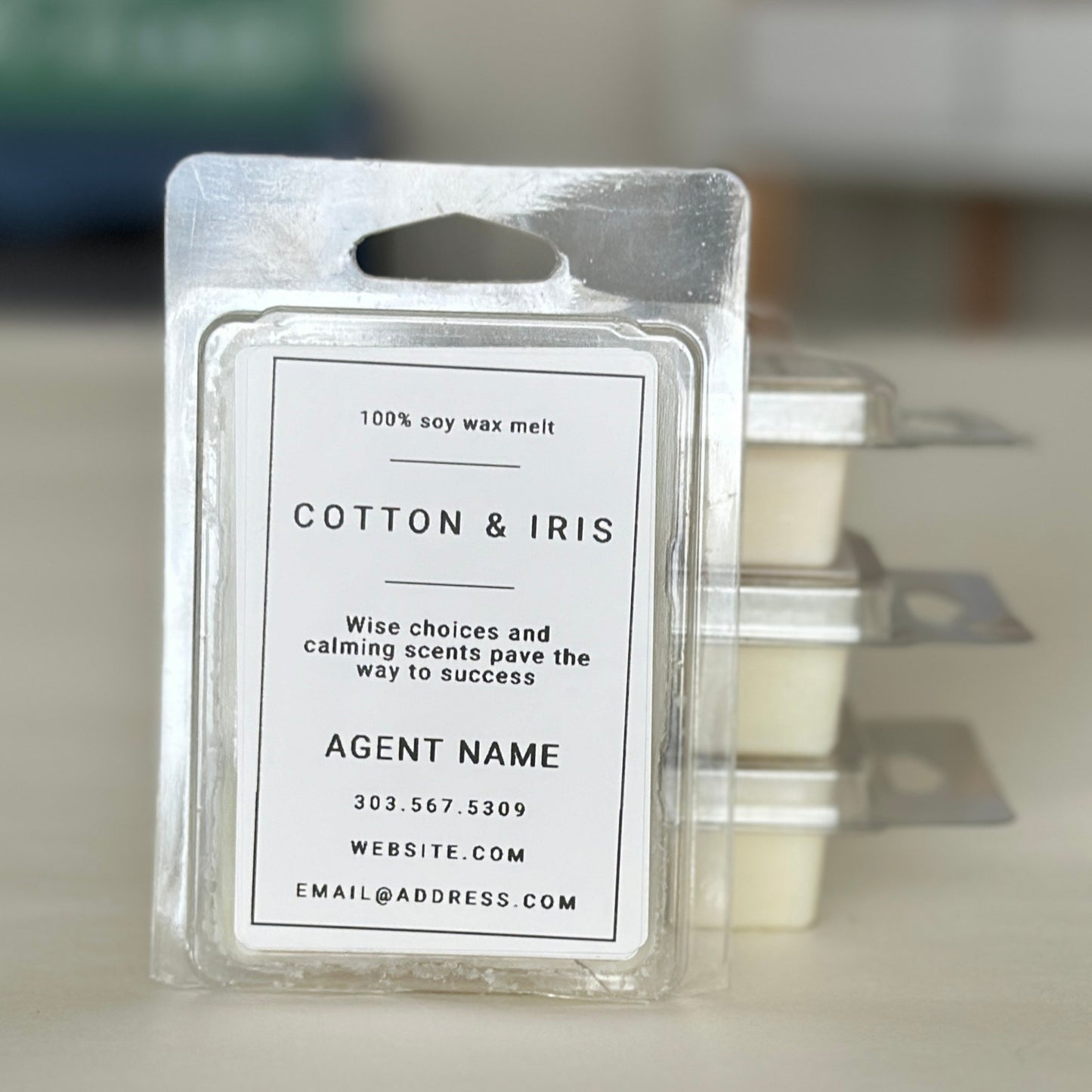 Close up Cotton and Iris soy wax melts personalized with real estate agent's name